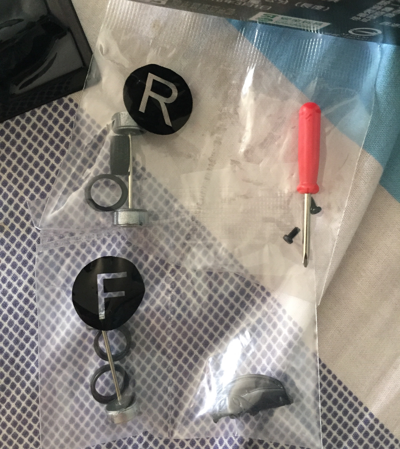 The bags of parts (comprising of wheels, axles, tyres, steering wheel, dashboard, screws and a mini screwdriver. The mini screwdriver was a PAIN IN THE A** to work with! :P